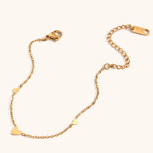 Load image into Gallery viewer, Embrace timeless elegance with this minimalist three heart O-Chain bracelet, crafted from premium stainless steel for a sleek and durable finish. Featuring a delicate chain adorned with three romantic heart charms, this bracelet adds a touch of luxury and femininity to any look. Perfect for everyday wear or special occasions, it’s a versatile and stylish accessory for any modern woman.