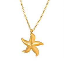 Load image into Gallery viewer, Make a bold statement with this edgy stainless steel star pendant necklace, designed for the modern woman with a punk-inspired aesthetic. Gold-plated for a sleek and stylish finish, this necklace exudes confidence and individuality. The striking star pendant adds a touch of celestial charm, making it the perfect accessory to elevate any look. Whether you're dressing up for a night out or adding a rebellious flair to your everyday style, this necklace is a versatile and eye-catching piece.
