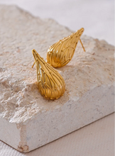 Load image into Gallery viewer, Add a touch of elegance to your look with these fashion stainless steel teardrop stud earrings. Featuring a sleek water drop design and a modern metal texture, these earrings are both trendy and timeless. Made from anti-allergic stainless steel, they offer comfort and durability, perfect for sensitive ears. Whether for everyday wear or a special occasion, these versatile earrings make a stylish addition to any jewelry collection and a thoughtful gift for someone special.