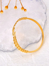 Load image into Gallery viewer, Elevate your style with this fashion stainless steel open charm bracelet. Featuring a stunning golden leaf plant design, this statement piece adds a touch of nature-inspired elegance to any outfit. Durable, waterproof, and crafted for lasting shine, it’s perfect for women who love versatile and eye-catching jewelry. Ideal for daily wear or as a thoughtful gift.