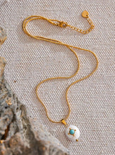 Load image into Gallery viewer, Add a touch of French elegance to your look with this stainless steel natural freshwater pearl necklace, featuring a delicate charm adorned with a turquoise stone at its center. Crafted with premium materials, this stylish piece is both waterproof and hypoallergenic, making it perfect for everyday wear without compromising on luxury. The natural freshwater pearl bring timeless beauty, while the turquoise stone adds a pop of color and a unique flair.