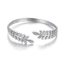 Load image into Gallery viewer, Elevate your style with this fashion stainless steel open charm bracelet. Featuring a stunning golden leaf plant design, this statement piece adds a touch of nature-inspired elegance to any outfit. Durable, waterproof, and crafted for lasting shine, it’s perfect for women who love versatile and eye-catching jewelry. Ideal for daily wear or as a thoughtful gift.