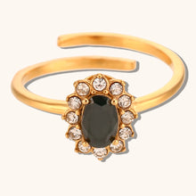 Load image into Gallery viewer, Add a touch of elegance to your look with this luxurious gold plated flower oval zircon ring. Crafted from durable stainless steel, this stunning piece features a sparkling oval zircon centerpiece surrounded by delicate floral details. Perfect for parties or special occasions, it exudes sophistication and charm, making it a must-have accessory for any woman’s jewelry collection.