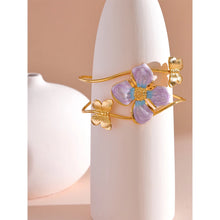Load image into Gallery viewer, Make a bold statement with our gold-plated stainless steel enamel open bangle, designed for fashionable women who love eye-catching accessories. This stylish bangle features an exaggerated, large design adorned with a delicate butterfly and a vibrant purple flower, adding a whimsical and feminine touch to any outfit. Perfect for making a statement at any occasion, this chic and modern bracelet is a must-have for those who want to stand out with elegance and creativity.