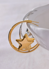 Load image into Gallery viewer, Enhance your style with these trendy stainless steel round star huggie earrings, available in sleek silver and radiant gold. Designed for modern women, their minimalist star charm adds a touch of elegance to any look. Crafted from anti-allergic stainless steel, they ensure comfort and durability, making them perfect for everyday wear. Whether as a thoughtful gift or a chic addition to your jewelry collection, these versatile earrings blend fashion and sophistication effortlessly.