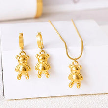 Load image into Gallery viewer, Add a playful touch to your style with these stainless steel gold color bear pendant earrings. Plated in radiant gold, these charming earrings feature adorable bear pendants that bring a fun yet sophisticated flair to any outfit. Durable and lightweight, they're perfect for everyday wear or as a delightful holiday gift. A unique and stylish addition to any jewelry collection!