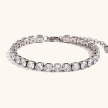 Load image into Gallery viewer, Elevate your style with this luxurious gold plated tennis bracelet, featuring dazzling AAA-grade zircon stones for a radiant sparkle. Crafted from durable stainless steel, this trendy bracelet combines elegance and durability, making it perfect for everyday wear or special occasions. A timeless accessory that adds a touch of sophistication to any outfit, it’s a must-have for any jewelry collection or a thoughtful gift for someone special.