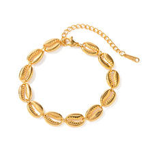 Load image into Gallery viewer, This exquisite stainless steel hollow shell bracelet in radiant 18K gold color is a beautiful blend of elegance and nature-inspired design. Featuring a delicate line of intricately crafted hollow shells, this bracelet is PVD plated for extra durability and a luxurious finish. Its waterproof quality makes it perfect for everyday wear, adding a touch of timeless charm to any outfit.