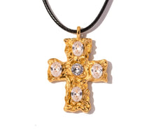 Load image into Gallery viewer, This glam rock necklace is made of stainless steel pendant which is hanging on a black wax rope. The beautiful cross pendant comes in two colours: gold and silver. It has irregular surface which is additionally adorned with 5 big cubic zirconia. It is a perfect piece for any daily occasion as well a great gift for your beloved friend. The necklace has lobster clasp and adjustable chain.