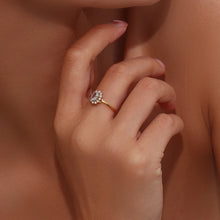 Load image into Gallery viewer, Add a touch of elegance to your look with this luxurious gold plated flower oval zircon ring. Crafted from durable stainless steel, this stunning piece features a sparkling oval zircon centerpiece surrounded by delicate floral details. Perfect for parties or special occasions, it exudes sophistication and charm, making it a must-have accessory for any woman’s jewelry collection.