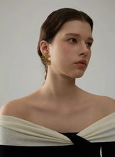 Load image into Gallery viewer, These statement stud earrings feature a striking fan-shaped design crafted from high-quality, waterproof stainless steel with a sleek gold finish. Hypoallergenic and gentle on sensitive skin, these bold earrings combine durability with style, making them perfect for adding a touch of charm to any outfit. Their unique fan-inspired strips create an eye-catching look, ideal for those who love fashion-forward jewelry that doesn’t compromise on comfort. Perfect for gifting or for elevating your own accessory col