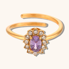 Load image into Gallery viewer, Add a touch of elegance to your look with this luxurious gold plated flower oval zircon ring. Crafted from durable stainless steel, this stunning piece features a sparkling oval zircon centerpiece surrounded by delicate floral details. Perfect for parties or special occasions, it exudes sophistication and charm, making it a must-have accessory for any woman’s jewelry collection.