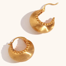 Load image into Gallery viewer, These trendy hoop earrings feature a charming basket boat shape with a unique edge design accented by small, delicate ball details. Crafted from durable stainless steel, they bring a playful yet sophisticated touch to any outfit, making them perfect for adding interest to everyday looks.