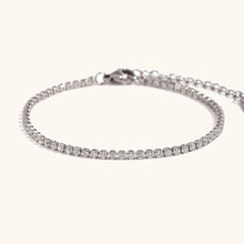 Load image into Gallery viewer, Elevate your style with this luxurious gold plated tennis bracelet, featuring dazzling AAA-grade zircon stones for a radiant sparkle. Crafted from durable stainless steel, this trendy bracelet combines elegance and durability, making it perfect for everyday wear or special occasions. A timeless accessory that adds a touch of sophistication to any outfit, it’s a must-have for any jewelry collection or a thoughtful gift for someone special.
