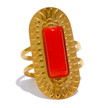 Load image into Gallery viewer, Make a statement with this striking square geometric open ring, featuring a bold, big stone available in four captivating colors: black, red, white, and green. Each stone is beautifully framed by a notched gold edge, adding texture and a luxurious touch to this modern design. Crafted from durable stainless steel and finished with high-quality gold plating, this wide, adjustable ring combines elegance with a contemporary twist, offering a perfect fit and lasting shine.