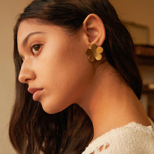 Load image into Gallery viewer, These Italian vintage-inspired flower stud earrings feature a frosted, brushed finish for a subtle yet elegant texture. Crafted from waterproof stainless steel, they offer lasting durability and timeless charm. Perfect as a thoughtful gift or a stylish accessory, these earrings add a touch of classic sophistication to any outfit, making them a versatile choice for women who appreciate refined, vintage-inspired jewelry.