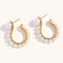 Load image into Gallery viewer, Make a bold statement with these exaggerated pearl hook earrings in a unique question mark shape. Crafted from durable stainless steel, these earrings are waterproof and hypoallergenic, ensuring comfort and long-lasting shine. The elegant pearl detail adds a touch of sophistication, making them perfect for both casual and formal occasions. A stylish and thoughtful gift for any jewelry lover!