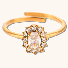 Load image into Gallery viewer, Add a touch of elegance to your look with this luxurious gold plated flower oval zircon ring. Crafted from durable stainless steel, this stunning piece features a sparkling oval zircon centerpiece surrounded by delicate floral details. Perfect for parties or special occasions, it exudes sophistication and charm, making it a must-have accessory for any woman’s jewelry collection.