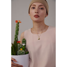 Load image into Gallery viewer, This simple stainless steel necklace comes in a gold and silver colour. It is adorned with a nice and delicate pendant in a shape of a heart. Irregular heart shape and its rugged surface gives this necklace a special touch. The necklace can be combined for any evening as well as for daily outfits. It has lobster clasp and adjustable chain.