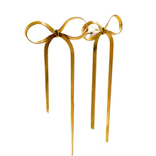Load image into Gallery viewer, These long tassel bow earrings are a striking statement piece, featuring a graceful bowknot design with sleek flat snake chains that add a sense of fluid movement. Made from high-quality stainless steel, they are both durable and lightweight, offering a stylishly modern look with a hint of elegance.