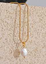 Load image into Gallery viewer, Add a touch of French elegance to your look with this stainless steel natural freshwater pearl necklace, featuring a delicate charm adorned with a turquoise stone at its center. Crafted with premium materials, this stylish piece is both waterproof and hypoallergenic, making it perfect for everyday wear without compromising on luxury. The natural freshwater pearl bring timeless beauty, while the turquoise stone adds a pop of color and a unique flair.