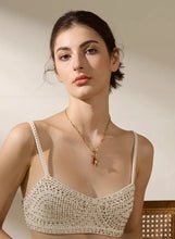 Load image into Gallery viewer, Add a touch of bold elegance to your look with our stainless steel pendant necklace. This eye-catching piece features a unique blend of intricate charms, including a vibrant red chili, a delicate hand, and a heart pendant, each symbolizing passion, energy, and heartfelt expression. Crafted from durable 316L stainless steel, this necklace offers long-lasting wear and a sleek, polished finish that adds sophistication to any outfit.Perfect for women who love personalized and meaningful jewelry, this necklace c