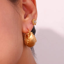 Load image into Gallery viewer, These trendy hoop earrings feature a charming basket boat shape with a unique edge design accented by small, delicate ball details. Crafted from durable stainless steel, they bring a playful yet sophisticated touch to any outfit, making them perfect for adding interest to everyday looks.