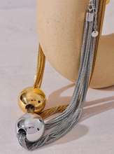 Load image into Gallery viewer, Make a bold statement with this trendy layered overlay chain necklace, featuring a sleek round ball pendant for a modern touch. Crafted from durable stainless steel, this waterproof design offers both style and versatility, perfect for any occasion. Its layered look adds depth and sophistication, making it an eye-catching accessory for those who love personalized, fashion-forward jewelry.