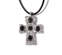 Load image into Gallery viewer, This glam rock necklace is made of stainless steel pendant which is hanging on a black wax rope. The beautiful cross pendant comes in two colours: gold and silver. It has irregular surface which is additionally adorned with 5 big cubic zirconia. It is a perfect piece for any daily occasion as well a great gift for your beloved friend. The necklace has lobster clasp and adjustable chain.
