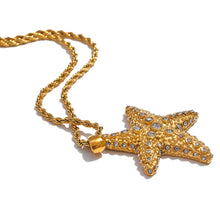 Load image into Gallery viewer, This stunning long necklace, crafted from stainless steel, features a striking starfish pendant that exudes summer elegance. The pendant is beautifully embellished with sparkling cubic zirconia, adding a radiant touch of glamour and sophistication. Perfect for elevating any summer outfit, this necklace effortlessly enhances your look with a hint of coastal charm and eye-catching sparkle. Designed for both style and practicality, it features a secure lobster clasp and an adjustable length.