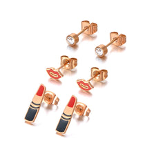 Load image into Gallery viewer, Add a playful touch to your style with this trendy stainless steel lips & lipstick earrings set. Featuring three unique pairs adorned with sparkling cubic zirconia crystals, these earrings are perfect for women who love fun and fashionable jewelry. Lightweight and durable, they effortlessly combine charm and versatility, making them a stylish choice for any occasion or a delightful gift.