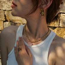 Load image into Gallery viewer, This elegant stainless steel necklace comes in two options, with pink or clear heart pendant. The necklace has a very interesting chain adorned with small stainless steel balls. The heart pendant is made of glass and it makes this necklace a perfect piece for an elegant occasion outfit. The necklace has a lobster clasp and adjustable length.