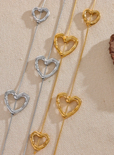 Load image into Gallery viewer, Add a touch of romance to your look with this stunning 85cm stainless steel heart contour charm necklace, available in both silver and gold finishes. Elegantly designed, this long chest chain features delicate heart-shaped charms spread along the length of the chain, creating a subtle yet captivating statement of love. Crafted from durable, waterproof stainless steel, this piece ensures lasting shine and beauty, making it perfect for both everyday wear and special occasions.