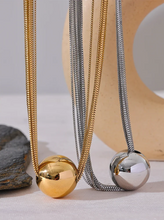 Load image into Gallery viewer, Make a bold statement with this trendy layered overlay chain necklace, featuring a sleek round ball pendant for a modern touch. Crafted from durable stainless steel, this waterproof design offers both style and versatility, perfect for any occasion. Its layered look adds depth and sophistication, making it an eye-catching accessory for those who love personalized, fashion-forward jewelry.