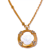 Load image into Gallery viewer, Add a touch of elegance to your look with this chic luxury round pendant necklace. Featuring a natural shell accented with a sparkling zircons and carved bee, this graceful design exudes French-inspired charm. Crafted from durable stainless steel, it’s waterproof and perfect for everyday wear or special occasions. A sophisticated accessory that blends style and durability, making it a timeless addition to any jewelry collection.