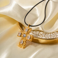 Load image into Gallery viewer, This glam rock necklace is made of stainless steel pendant which is hanging on a black wax rope. The beautiful cross pendant comes in two colours: gold and silver. It has irregular surface which is additionally adorned with 5 big cubic zirconia. It is a perfect piece for any daily occasion as well a great gift for your beloved friend. The necklace has lobster clasp and adjustable chain.