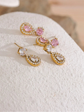 Load image into Gallery viewer, Add a touch of elegance with these shiny cubic zirconia water drop dangle earrings. Crafted from durable stainless steel, these exquisite earrings feature sparkling zirconia stones in a delicate drop design, perfect for any occasion. Lightweight and stylish, they offer a timeless charm that enhances both casual and formal looks. A must-have accessory or a thoughtful gift for someone special!