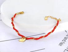 Load image into Gallery viewer, Embrace timeless elegance with this combined ethnic red rope and chain bracelet, crafted from durable titanium stainless steel and plated with 18K gold for a luxurious finish. Featuring a trendy design with a good luck charm, this bracelet combines style and symbolism, making it perfect for everyday wear or as a meaningful gift for women who value both fashion and tradition.