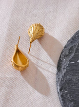 Load image into Gallery viewer, Add a touch of elegance to your look with these fashion stainless steel teardrop stud earrings. Featuring a sleek water drop design and a modern metal texture, these earrings are both trendy and timeless. Made from anti-allergic stainless steel, they offer comfort and durability, perfect for sensitive ears. Whether for everyday wear or a special occasion, these versatile earrings make a stylish addition to any jewelry collection and a thoughtful gift for someone special.