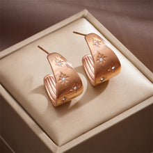 Load image into Gallery viewer, These unique earrings showcase an artistic blend of bohemian charm with a playful design, featuring a banana-shaped water drop element and diagonal circular accents, adorned with shimmering zircons. The intricate long eyelash details add texture and flair, making these earrings a true statement piece. Perfect for adding a touch of creativity and sparkle to any look, these earrings are ideal for those who love bold, eye-catching jewelry.