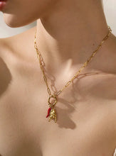 Load image into Gallery viewer, Add a touch of bold elegance to your look with our stainless steel pendant necklace. This eye-catching piece features a unique blend of intricate charms, including a vibrant red chili, a delicate hand, and a heart pendant, each symbolizing passion, energy, and heartfelt expression. Crafted from durable 316L stainless steel, this necklace offers long-lasting wear and a sleek, polished finish that adds sophistication to any outfit.Perfect for women who love personalized and meaningful jewelry, this necklace c