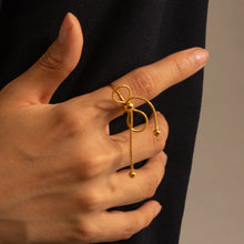 Load image into Gallery viewer, This elegant open slim ring features a charming bow design with delicate tassel accents, crafted from durable stainless steel and plated in radiant 18K gold. Waterproof and stylish, it’s perfect for daily wear or special occasions, offering a blend of sophistication and modern flair. A versatile accessory for women and girls, this new arrival adds a graceful touch to any jewelry collection.