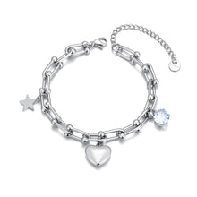 Load image into Gallery viewer, Add a touch of elegance and charm to your look with this stainless steel cubic zirconia crystal charm bracelet. Plated in radiant 18K gold, this delicate chain bracelet features a trio of enchanting charms—a sparkling zircon, a shining star, and a timeless heart. Perfect for everyday wear or special occasions, this bracelet combines durability and style, making it a versatile addition to any jewelry collection or a thoughtful gift for someone special.