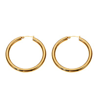 Load image into Gallery viewer, Make a bold statement with these chunky geometric gold plated hollow hoop earrings. Featuring a sleek, thick design and crafted from durable stainless steel, these big circle hoops offer a modern yet timeless look. Their radiant gold plating adds a touch of luxury, making them perfect for both everyday wear and special occasions. A chic and versatile accessory for any jewelry collection!