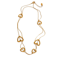 Load image into Gallery viewer, Add a touch of romance to your look with this stunning 85cm stainless steel heart contour charm necklace, available in both silver and gold finishes. Elegantly designed, this long chest chain features delicate heart-shaped charms spread along the length of the chain, creating a subtle yet captivating statement of love. Crafted from durable, waterproof stainless steel, this piece ensures lasting shine and beauty, making it perfect for both everyday wear and special occasions.
