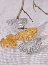 Load image into Gallery viewer, These statement stud earrings feature a striking fan-shaped design crafted from high-quality, waterproof stainless steel with a sleek gold finish. Hypoallergenic and gentle on sensitive skin, these bold earrings combine durability with style, making them perfect for adding a touch of charm to any outfit. Their unique fan-inspired strips create an eye-catching look, ideal for those who love fashion-forward jewelry that doesn’t compromise on comfort. Perfect for gifting or for elevating your own accessory col