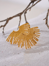 Load image into Gallery viewer, These statement stud earrings feature a striking fan-shaped design crafted from high-quality, waterproof stainless steel with a sleek gold finish. Hypoallergenic and gentle on sensitive skin, these bold earrings combine durability with style, making them perfect for adding a touch of charm to any outfit. Their unique fan-inspired strips create an eye-catching look, ideal for those who love fashion-forward jewelry that doesn’t compromise on comfort. Perfect for gifting or for elevating your own accessory col