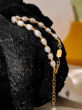 Load image into Gallery viewer, Embrace timeless elegance with this stunning natural freshwater pearl and stainless steel bead bracelet. Expertly handcrafted, this bracelet alternates lustrous freshwater pearls with polished stainless steel beads, creating a harmonious blend of classic and contemporary style. Finished with waterproof PVD coating, this durable piece is designed for everyday wear while maintaining its exquisite beauty.