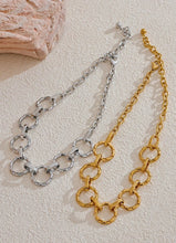 Load image into Gallery viewer, Make a bold style statement with this trendy metal round links chain necklace, featuring oversized, notched links that create a striking and modern look. Crafted from high-quality stainless steel, this necklace is designed to be both waterproof and durable, ensuring it maintains its shine through everyday wear. Its unique, individualistic design makes it the perfect accessory for those who love to stand out with distinctive, fashion-forward pieces.