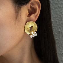Load image into Gallery viewer, Add a touch of romance to your look with these exquisite French-inspired earrings. Featuring irregular hammered stainless steel circles with elegant hanging pearls, they blend vintage charm with modern sophistication. Perfect for weddings, anniversaries, or special occasions, these earrings make a timeless statement and a thoughtful gift for someone special.